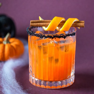 Halloween Orange Cocktail with Black Salt Rim