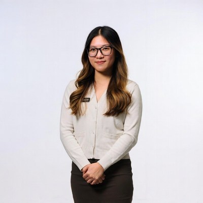 Asian woman in cardigan and skirt