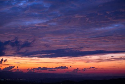 Vibrant Purple Orange Sunset Over Mountains