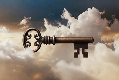 Vintage key floating in clouds
