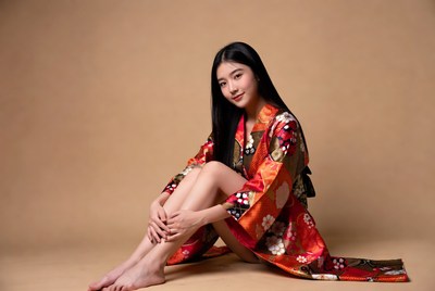Asian woman in colorful kimono sitting