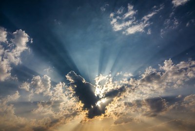 Sun rays bursting through clouds