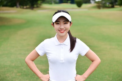 Asian woman golfer on green