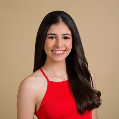 Smiling Latina woman in red dress