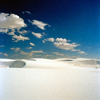 White Sand Dunes Under Blue Sky