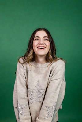 Smiling woman in starry sweater