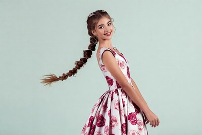 Girl in floral dress with long braid