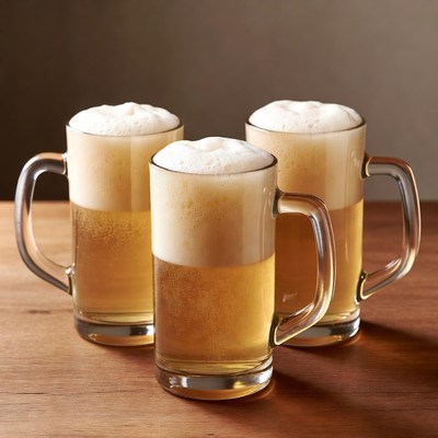 Three Pints of Beer on Wooden Table