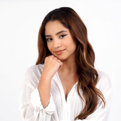 Smiling Latina woman hand on chin