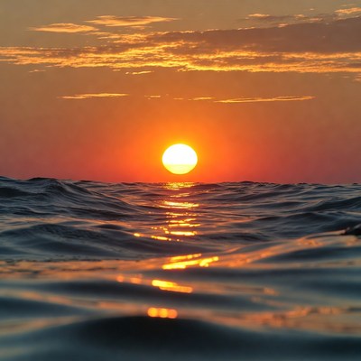 Sunset over ocean waves