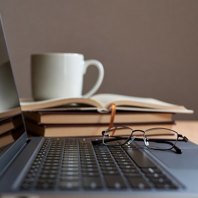 Laptop with glasses and coffee