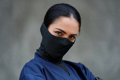Woman in black face mask and navy kimono