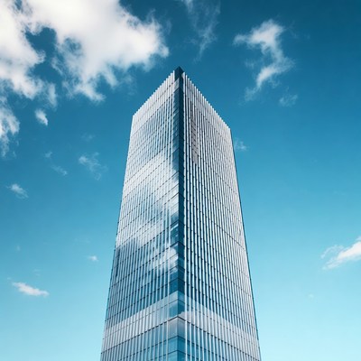 Tall Glass Skyscraper Under Blue Sky