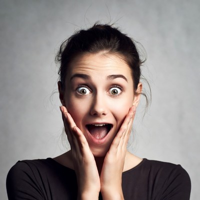 Surprised woman with wide eyes