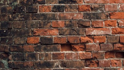 Old weathered red brick wall
