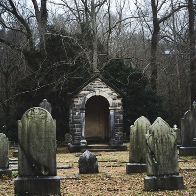 Stone Mausoleum in Foggy Cemetery