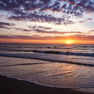 Ocean Sunset over Beach Waves