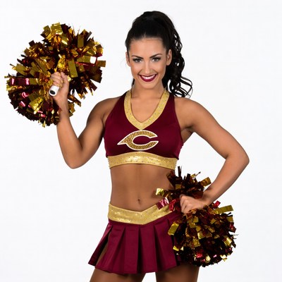 Cheerleader with pom poms posing