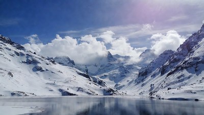 Snowy Mountain Lake with Clouds