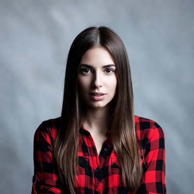 Woman in red plaid shirt