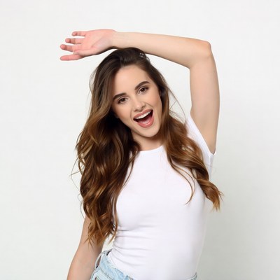 Smiling woman raising arm