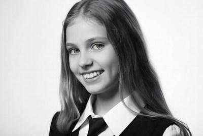 Smiling girl in school uniform