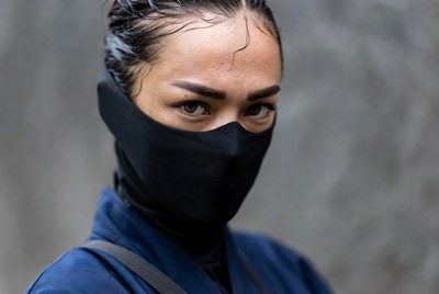 Asian woman in black face mask