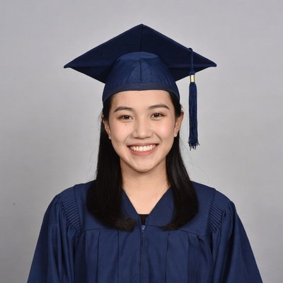 Asian woman in graduation gown