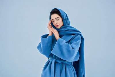 Middle Eastern woman in blue hijab coat