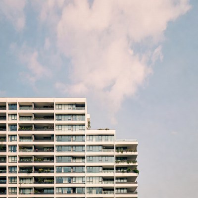 Modern White Apartment Building with Balconies