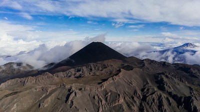 Volcano summit above clouds