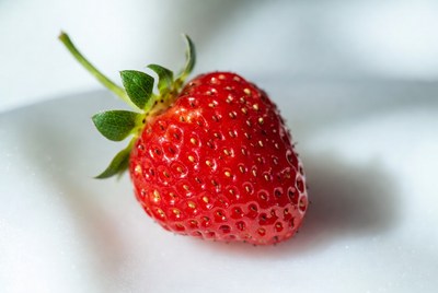 Fresh red strawberry on white