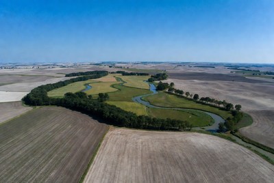 Aerial view of river in farmland