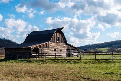 Old Wooden Barn in Rural Field