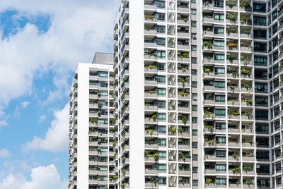Modern White High-Rise with Balcony Plants