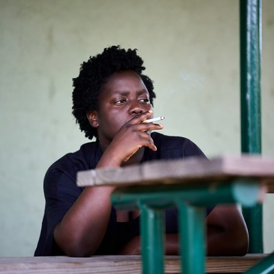 African-American woman smoking cigarette