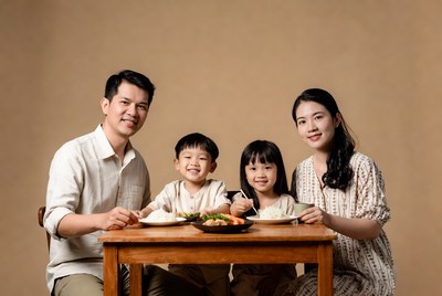 Asian family eating dinner together