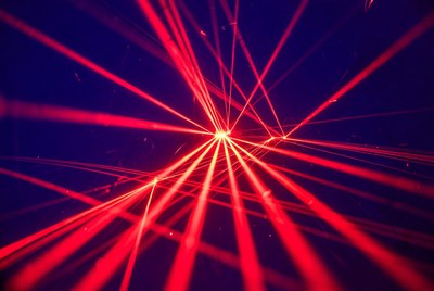 Red laser beams on dark background
