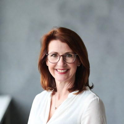 Smiling redhead woman in glasses