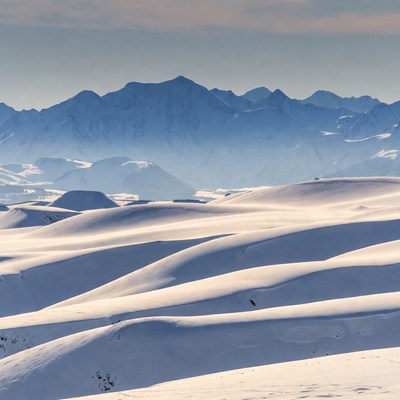 Snowy Mountains and Dunes Landscape