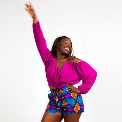 African-American woman dancing in colorful outfit