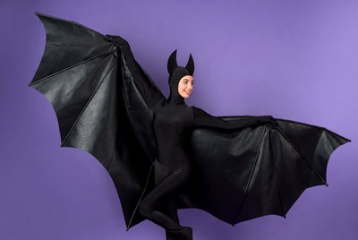 Woman in black bat costume