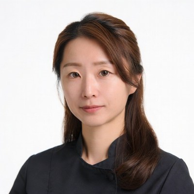 Asian woman in black uniform