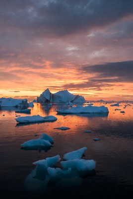 Icebergs in sunset Arctic waters