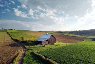 Red Barn in Rolling Green Fields