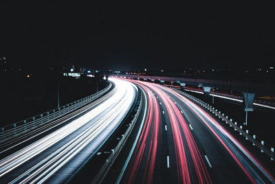 Highway at night with light trails