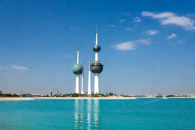 Kuwait Towers by turquoise water