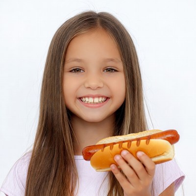 Girl holding hot dog