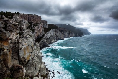 Dramatic Cliffs Over Crashing Ocean Waves