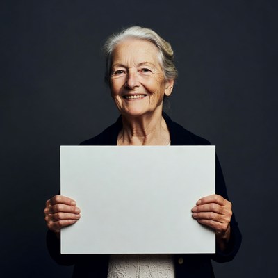 Elderly woman holding blank sign